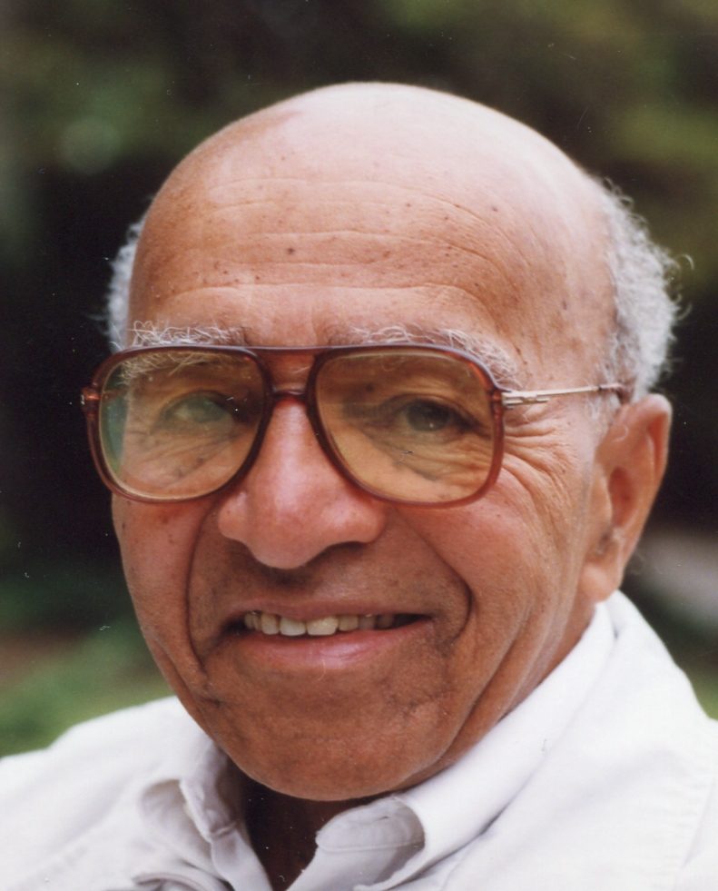 David Blackwell in 1999: an older man with glasses and a white shirt, smiling, outdoors